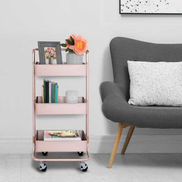 Rose gold cart next to chair
