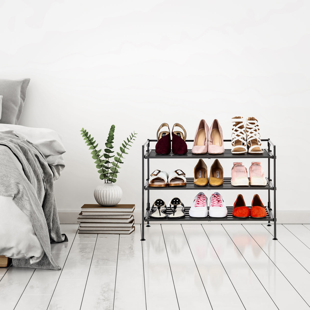Espresso shoe rack next to bed