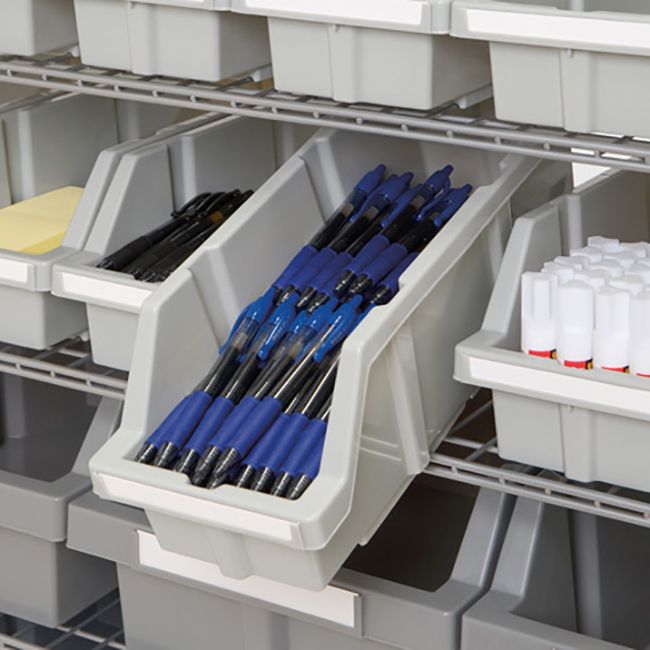 Close up of pens in tilted bin