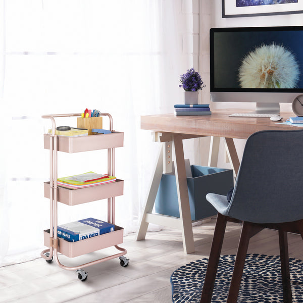 Rose gold cart next to desk