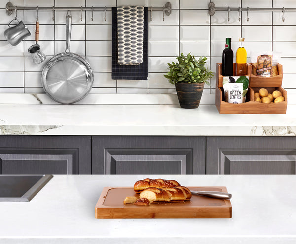 Bamboo set propped with cutting board in kitchen