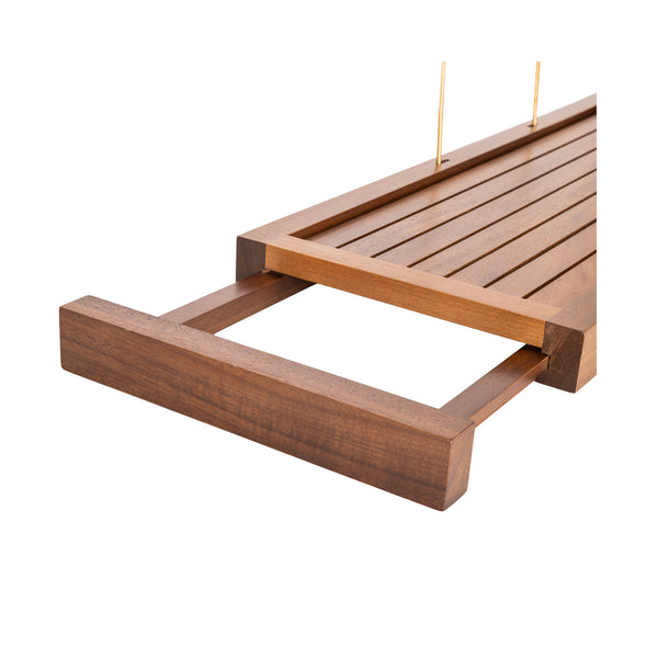 A close-up of an expandable wooden tray on a white background.