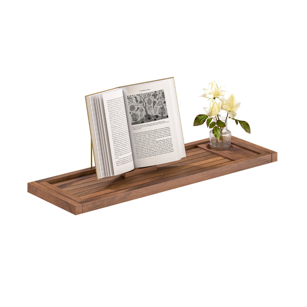 A rectangular wooden tray with a warm medium-brown finish, styled with an open book and a small glass vase of white flowers, set against a solid white background.