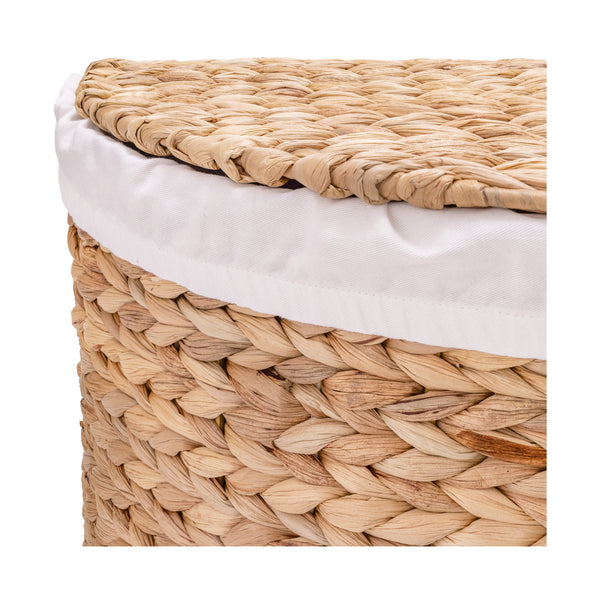 Close-up of a woven natural-fiber storage basket with a white fabric liner or cushion visible along the top edge, shown on a plain white background.