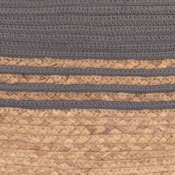 Close-up of a woven textile with horizontal bands of dark gray rope at the top and bottom, and natural tan braided stripes in the middle.