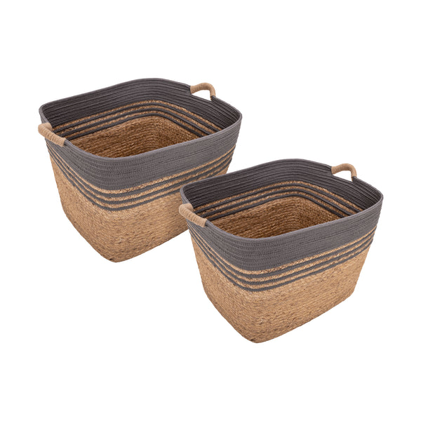 Two woven storage baskets with dark gray rope and loop handles, made from natural tan water hyacinth, shown on a white background.