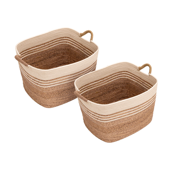 Two woven storage baskets with rounded rectangular shapes, natural water hyacinth, cream rope trim, and loop handles, shown on a plain white background.
