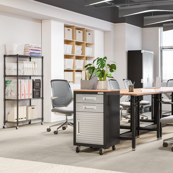 Modern office space with desks, chairs, and bookshelves.
