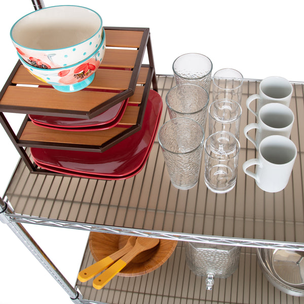 Shelf liner propped with kitchenware