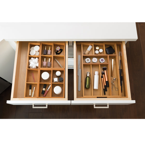 Expanded drawer organizer with box sets propped with beauty supplies