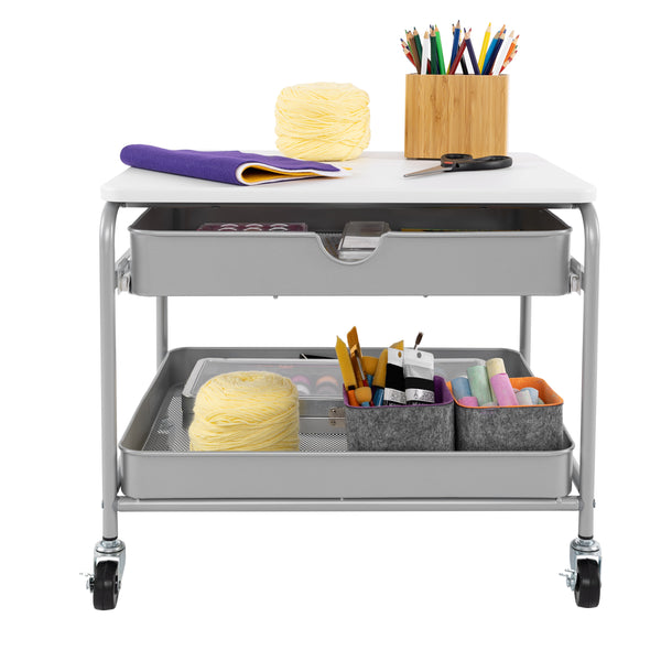 Front view of propped cart with arts supplies