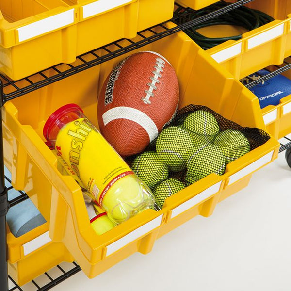 Close up of yellow bins with sport supplies